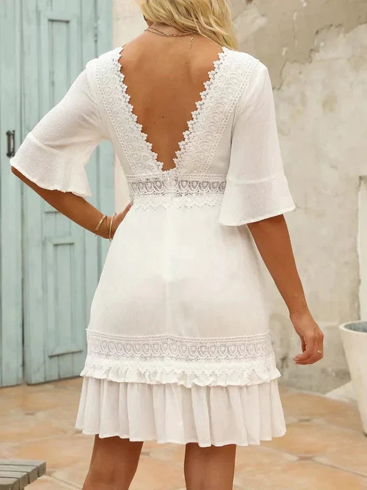 Vestido de playa blanco Linde con encaje y falda acampanada