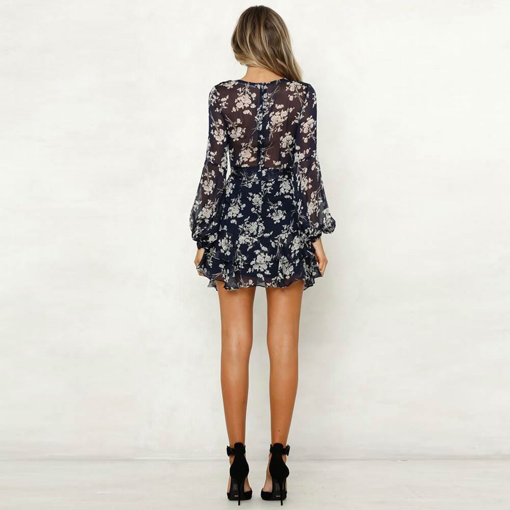 Vestido corto azul Carlijne con escote en V y estampado de flores azules