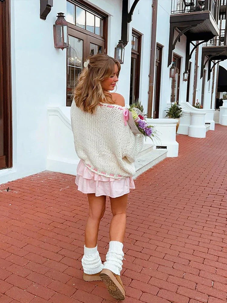 Suéter de lana mujer con lazos, elegante y juguetón