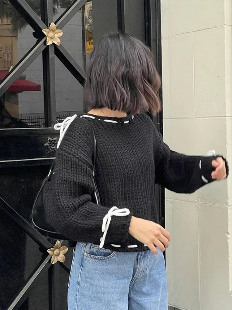 Suéter de lana mujer con lazos, elegante y juguetón